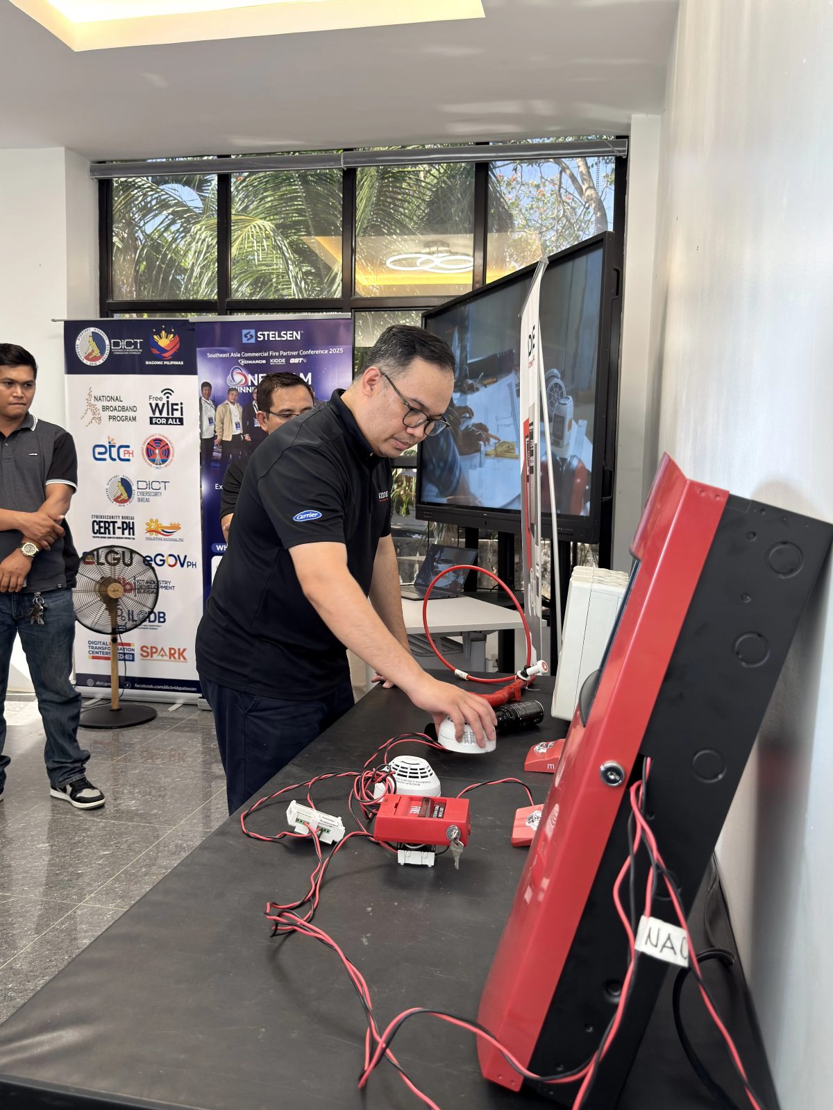 Stelsen engineer testing fire alarm detectors and devices